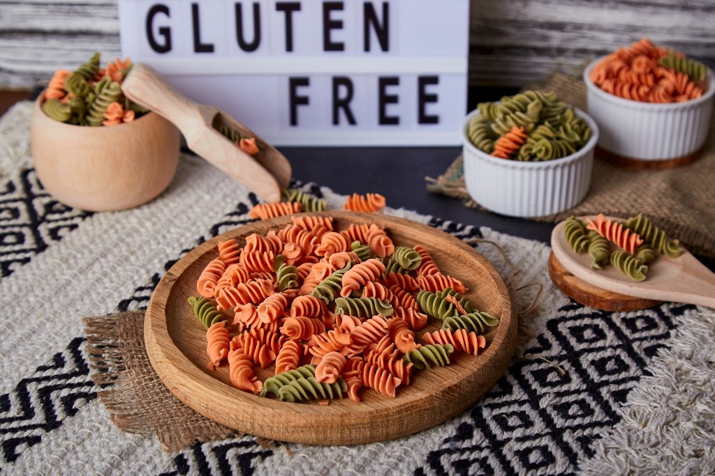 Gluten free text, fusilli pasta made of lentil and chickpea. Organic cuisine, raw product for cooking.