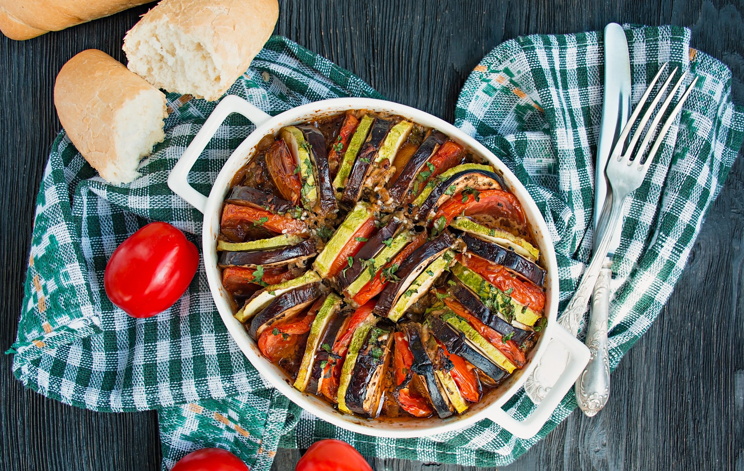 Ratatouille is a traditional French vegetable dish cooked in the oven. Diet vegetarian dish. Balanced nutrition. Eco food. French Diet concept